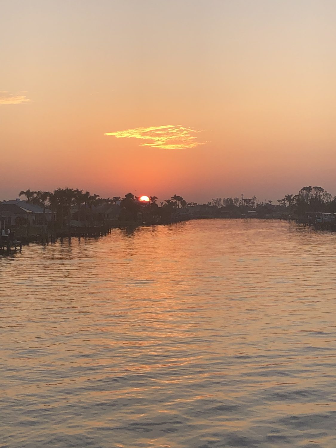 Orange sunset over a private Cape Coral canal
