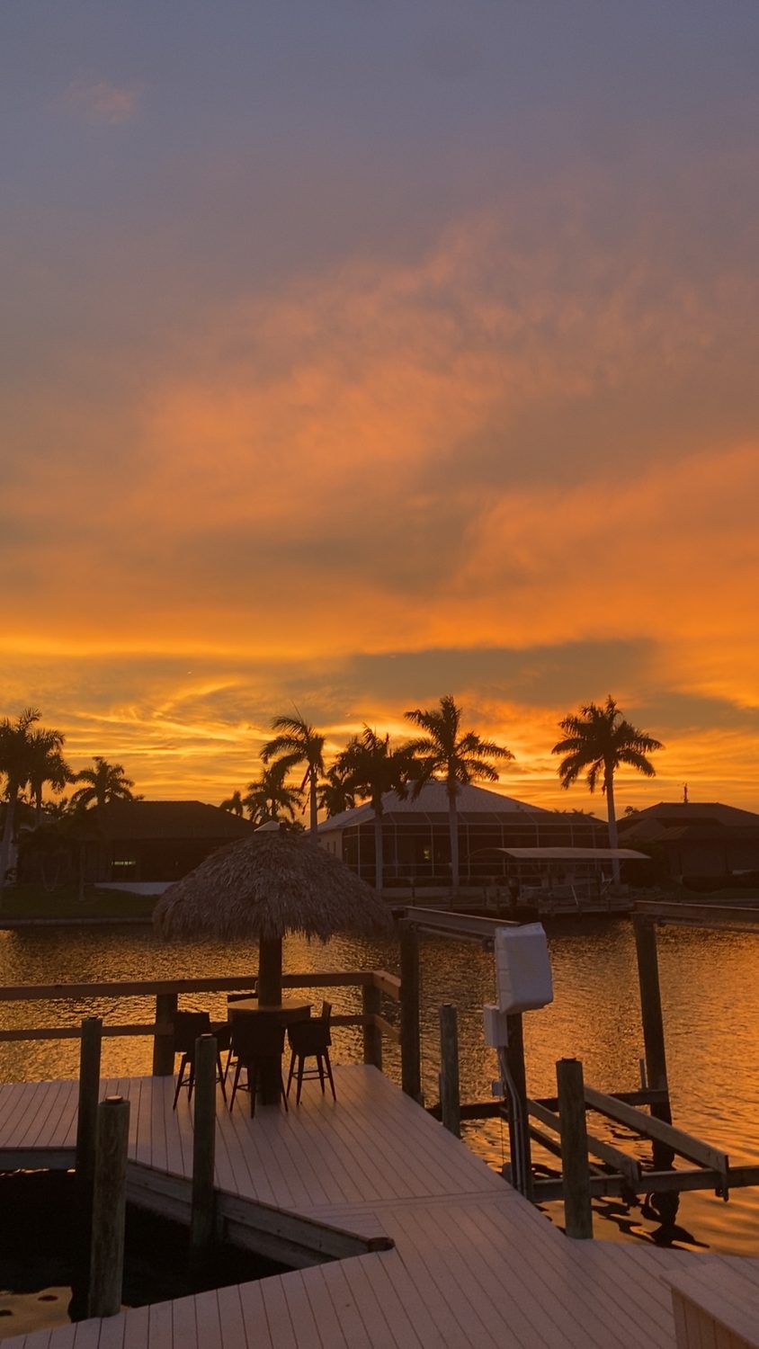A private tiki bar at sunset on a Cape Coral canal